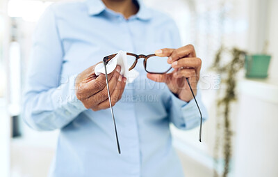 Buy stock photo Hands, cleaning glasses with fabric and hygiene, vision and eye care with health and wellness. Person with eyewear, maintenance and wipe away dust with microfiber cloth, closeup and frame with lens