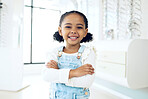 Optometry store, arms crossed and portrait of happy child shopping for eyeglasses, optical clinic product or youth eyewear. Prescription lens frame, ocular eye care and young kid customer for glasses