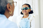 Vision, glasses or eye test with a girl and optician in an eyewear store for prescription frame lenses. Medical, consulting or spectacles with a young child and woman optometrist in an office