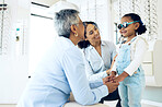 Optometrist, mother and child holding hands shopping for spectacles in trial frame at store. Mature ophthalmologist, mom and happy kid in test for glasses, vision and consulting for health or support