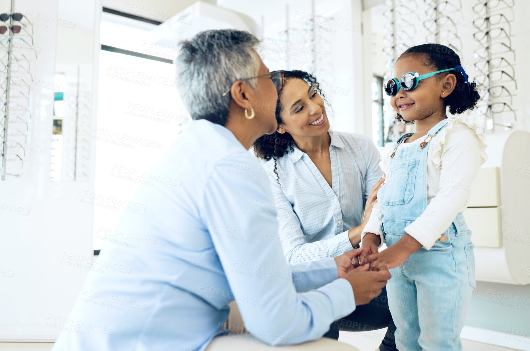 Buy stock photo Optometrist, mother and child holding hands shopping for spectacles in trial frame at store. Mature ophthalmologist, mom and happy kid in test for glasses, vision and consulting for health or support