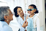 Optometry, eye test and optometrist with child and mother at an ophthalmology appointment. Medical, wellness and senior optician with young mom and girl kid patient with lenses in an optical clinic.