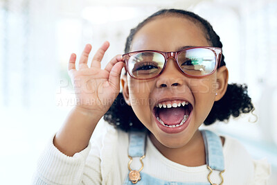 Buy stock photo Store, portrait and child excited for eyeglasses, lens frame and scream for optical eyewear, ocular wellness or optometry service. Happy energy, vision support or young kid girl with eye care glasses