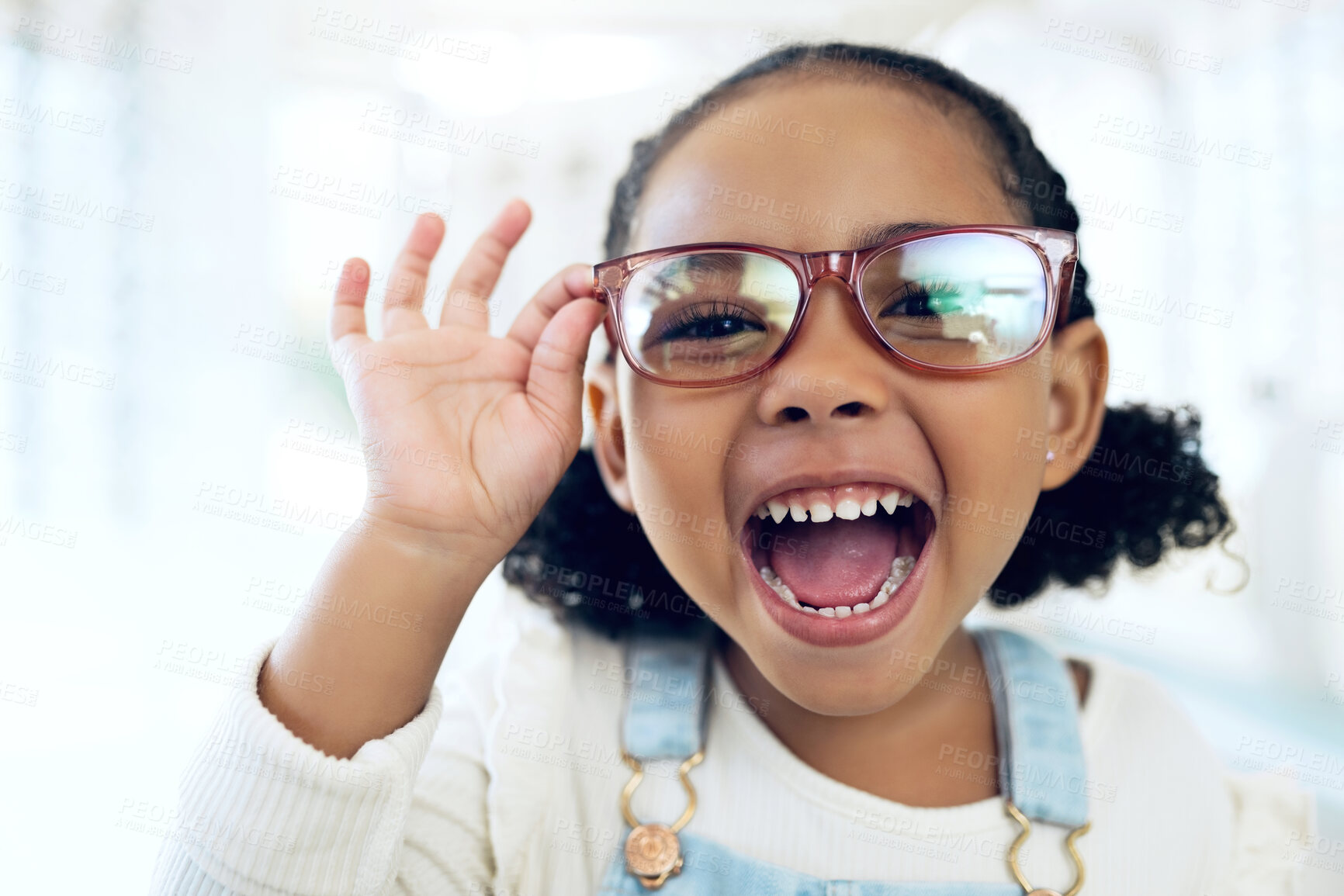 Buy stock photo Store, portrait and child excited for eyeglasses, lens frame and scream for optical eyewear, ocular wellness or optometry service. Happy energy, vision support or young kid girl with eye care glasses