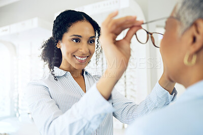 Buy stock photo Optometrist, eye care choice or customer with glasses for vision in a retail optical or eyewear shop. Happy woman, smile or client with new spectacles, frame or doctor at optics clinic store for help