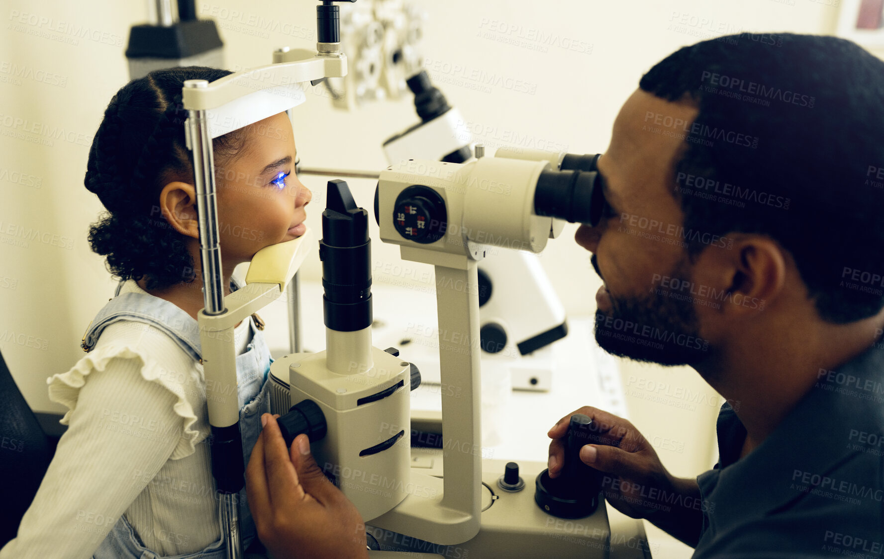 Buy stock photo Eye doctor, machine or child consulting to help eyesight at optometrist for a optical assessment. Optician, slit lamp or kid in test for vision, iris or retina health with laser technology or man