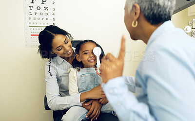 Buy stock photo Optometry, eye exam and optometrist with child and mother at a medical appointment for vision test. Health, wellness and senior optician with mom and girl kid patient with lenses in an optical clinic