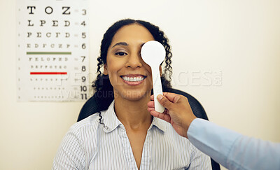 Buy stock photo Woman, eye exam and occluder with optometrist test, check and lens for vision, wellness and healthcare in clinic. Doctor, eyesight tools and machine for assessment, consultation and cover in hospital