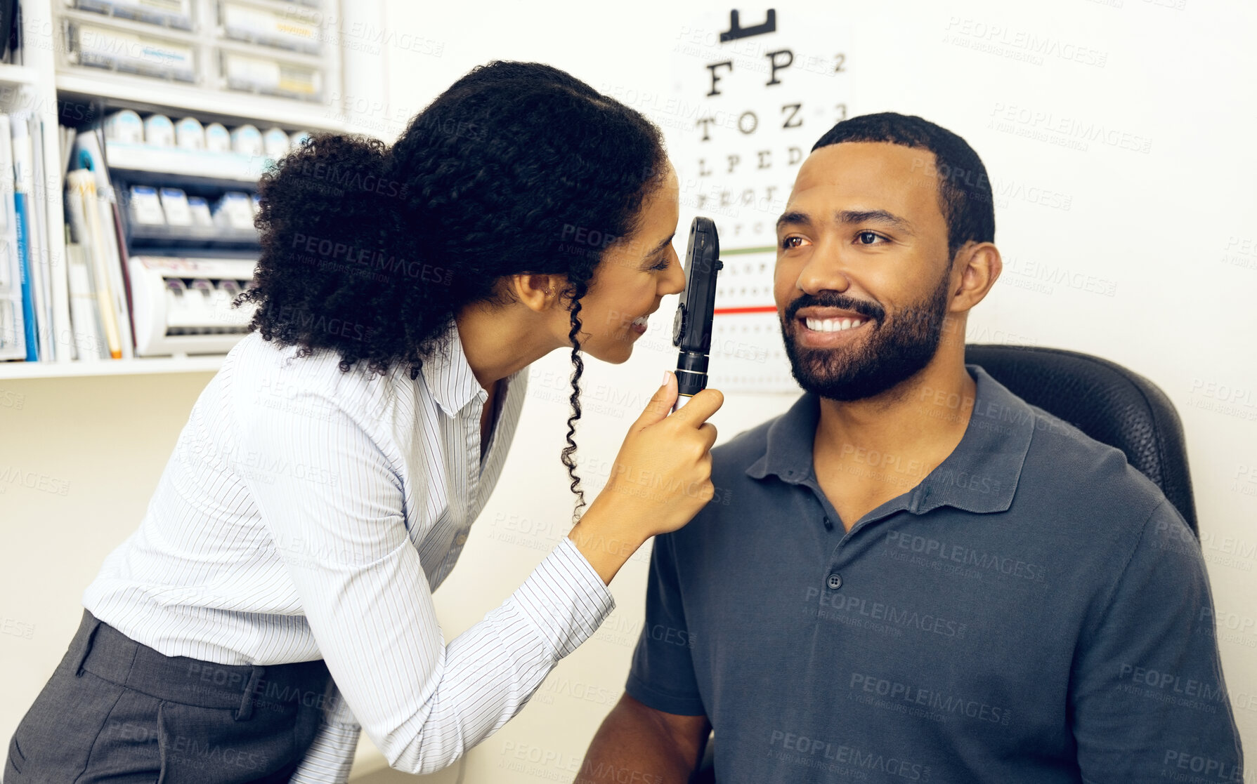 Buy stock photo Patient, eye care and healthcare in clinic with ophthalmoscope to check for glaucoma, ocular services and assessment. Optician, woman and retina analysis for eyesight of happy man with expert tools