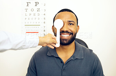 Buy stock photo Man, optometrist and eye test for eyesight, optometry and spoon in portrait, optician and consultation. Vision, exam and specialist for healthcare, medical and clinic for perception, expert or sight