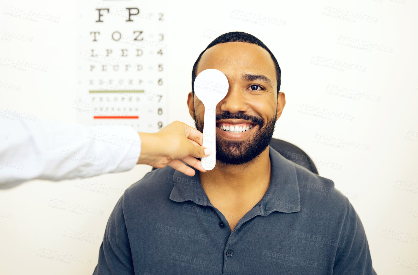 Buy stock photo Man, optometrist and eye test for eyesight, optometry and spoon in portrait, optician and consultation. Vision, exam and specialist for healthcare, medical and clinic for perception, expert or sight