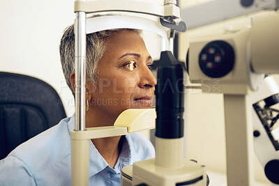 Buy stock photo Senior woman, eye exam with vision and laser machine, health and vision with optometry and wellness at clinic. Patient, LED light and scan retina for assessment with prescription and technology