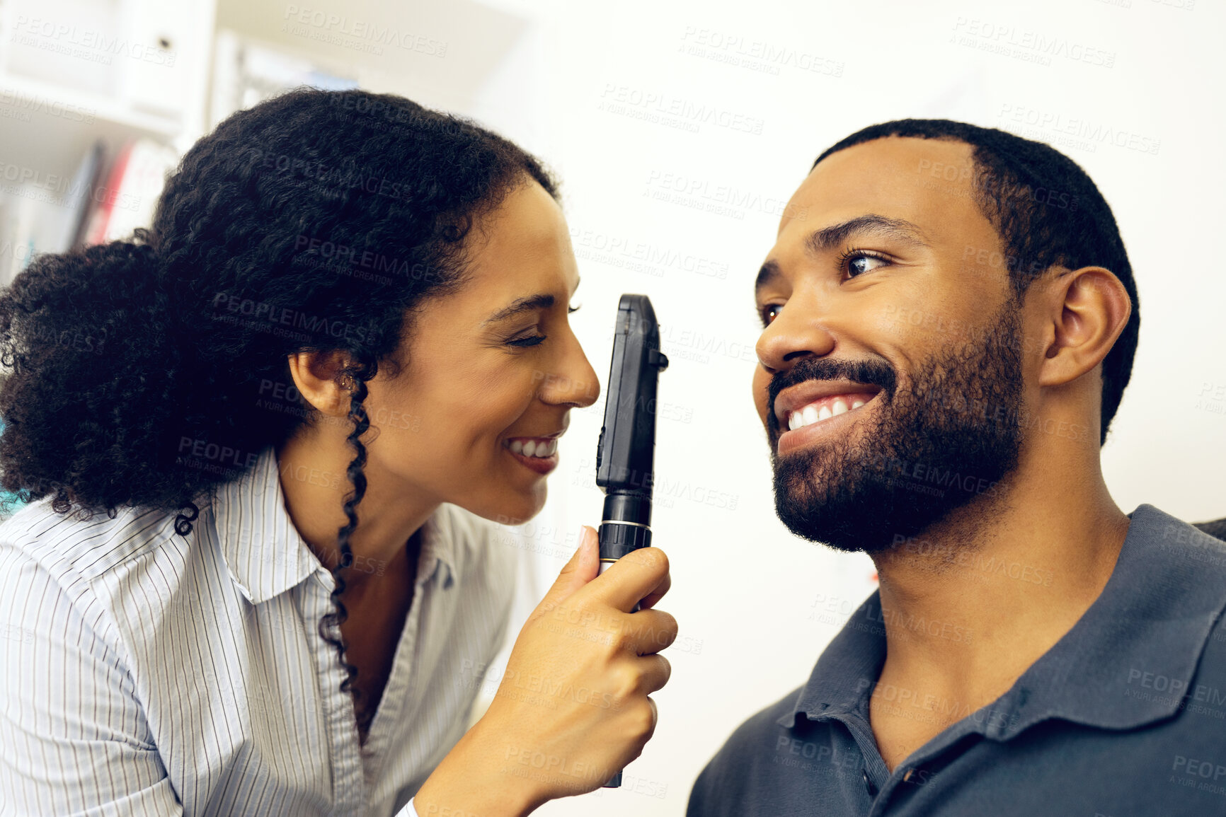 Buy stock photo Patient, eye exam and test in clinic with ophthalmoscope to check for glaucoma, ocular services or healthcare assessment. Happy optician, woman and retina analysis for eyesight of man with lens tools