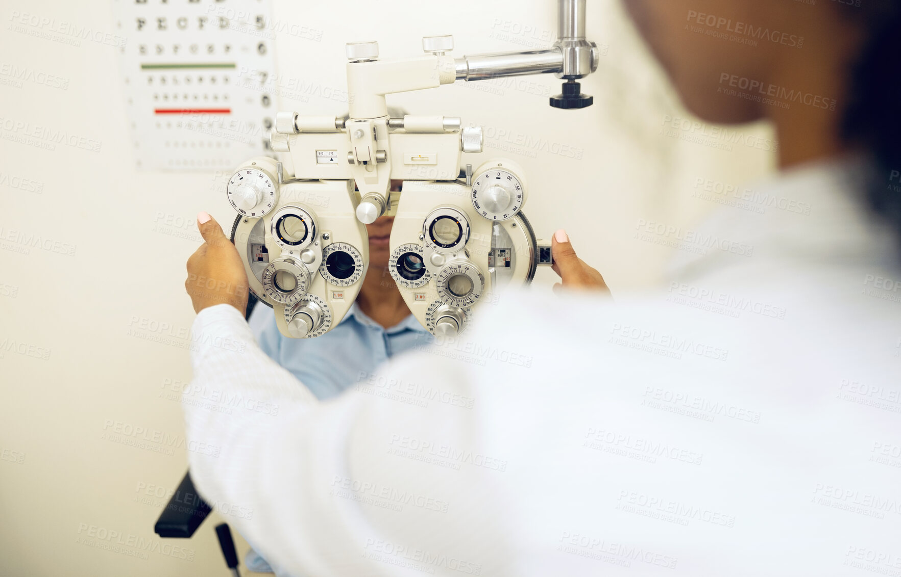 Buy stock photo Woman, eye exam and phoropter for optometrist with health check, lens or vision for wellness in clinic. Doctor, eyesight tools or machine for help with assessment, consultation or glasses in hospital