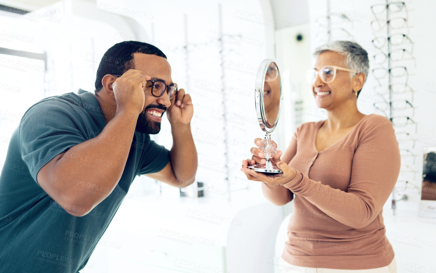 Buy stock photo Optometry, doctor and patient with glasses choice in store, health and insurance with communication and vision. Service, help and trust with mirror, eye care consultation with man and woman in clinic