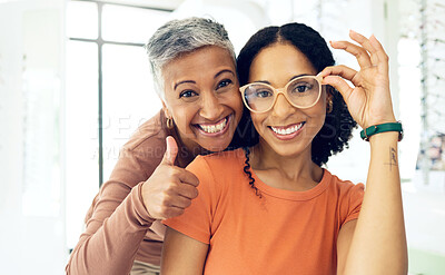 Buy stock photo Portrait, senior and women with glasses and thumbs up for vision, wellness or optometry at optometrist. Elderly, face and person with happiness for eyewear, eye care and yes for success or service