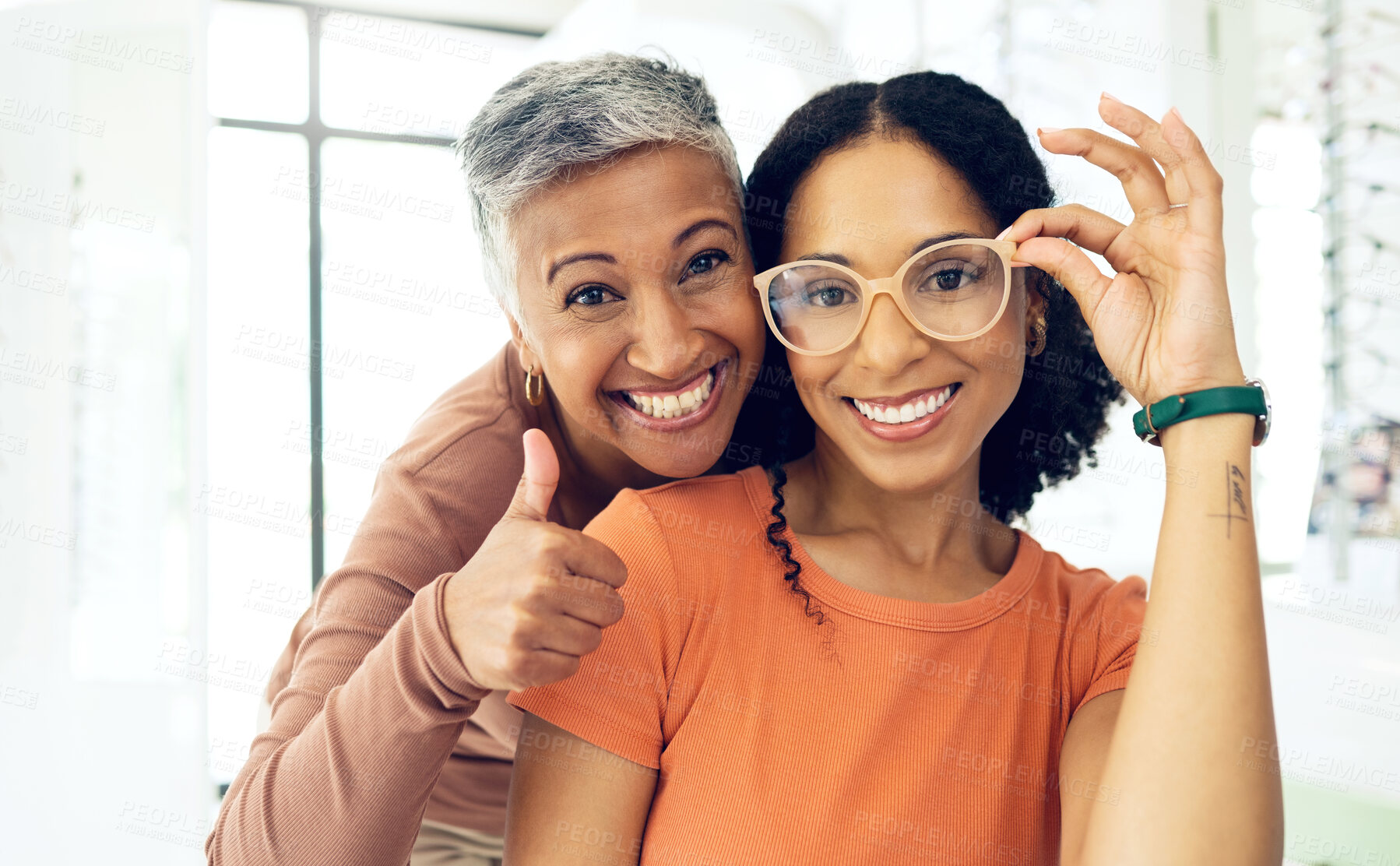 Buy stock photo Portrait, senior and women with glasses and thumbs up for vision, wellness or optometry at optometrist. Elderly, face and person with happiness for eyewear, eye care and yes for success or service