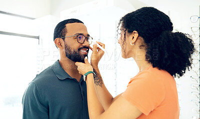 Buy stock photo Man, woman optometrist and glasses fitting in store with prescription, eye care and healthy vision. Male customer, consulting and optician with spectacles for better eyesight, reading and wellness