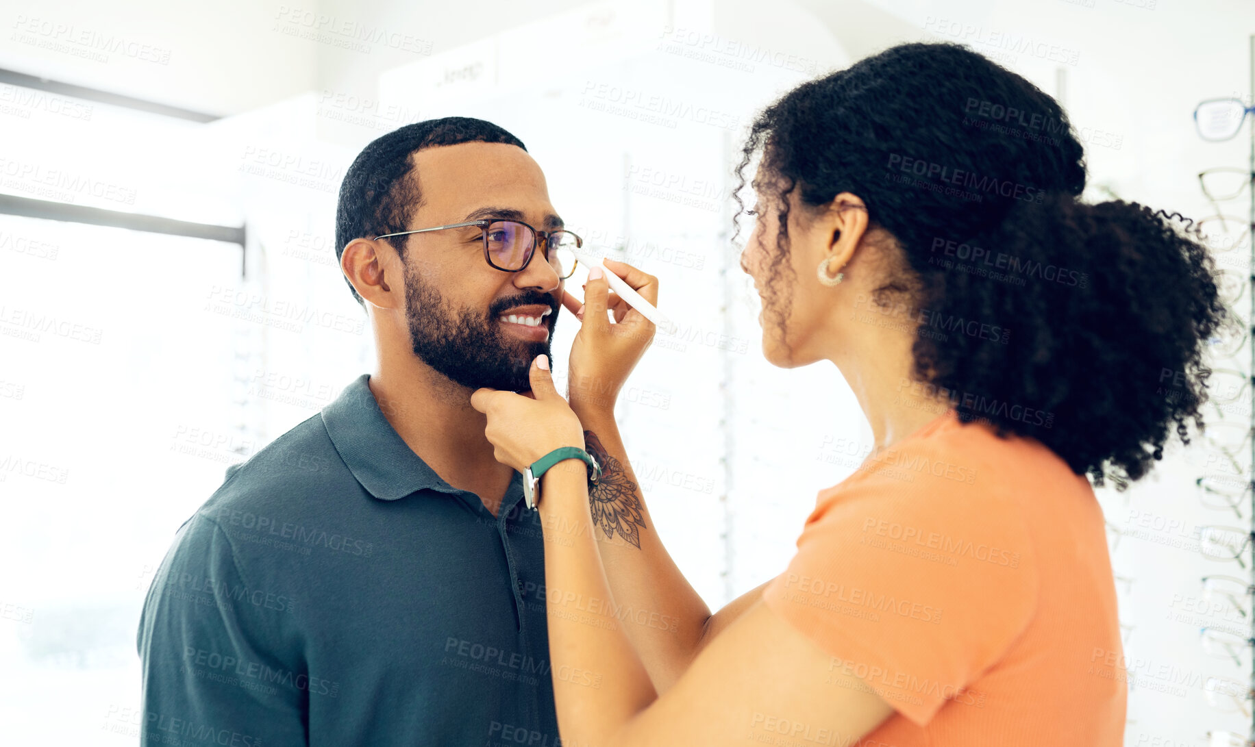 Buy stock photo Man, woman optometrist and glasses fitting in store with prescription, eye care and healthy vision. Male customer, consulting and optician with spectacles for better eyesight, reading and wellness