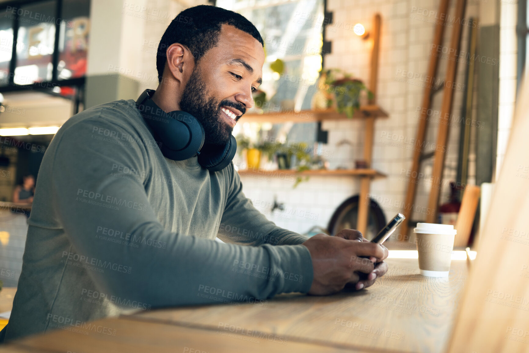 Buy stock photo Man, relax in coffee shop with smartphone and typing text or email, social media and online communication. Break at cafe, mobile app and scroll internet, search engine and chat with smile and tech