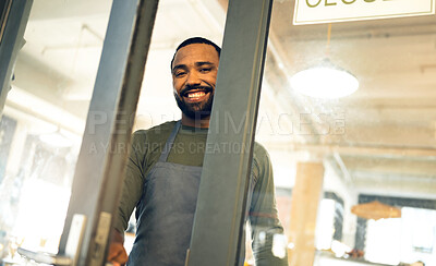 Buy stock photo Happy, door and portrait of a man at a coffee shop to open a small business or welcome customer. Smile, work and a waiter or barista at the entrance of a cafe, restaurant or cafeteria for service