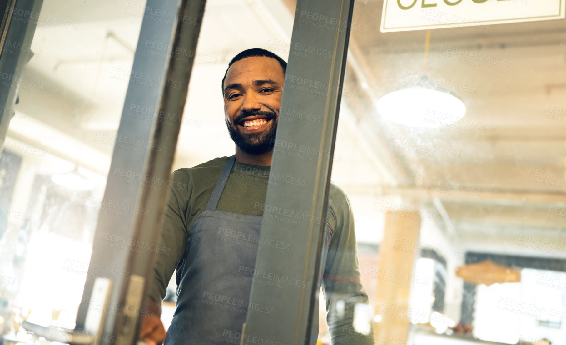 Buy stock photo Happy, door and portrait of a man at a coffee shop to open a small business or welcome customer. Smile, work and a waiter or barista at the entrance of a cafe, restaurant or cafeteria for service