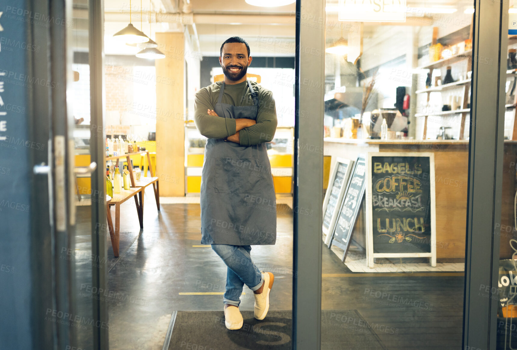 Buy stock photo Happy man, portrait and professional in small business cafe with arms crossed in confidence or retail management. Male person, barista or waiter smile by entrance of coffee shop, store or restaurant