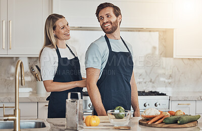 Buy stock photo Kitchen, apron and couple with cooking, smile and healthy food with ingredients, bonding and anniversary. Happy people, home and man with woman, recipe and bonding with activity, lunch and vegetables