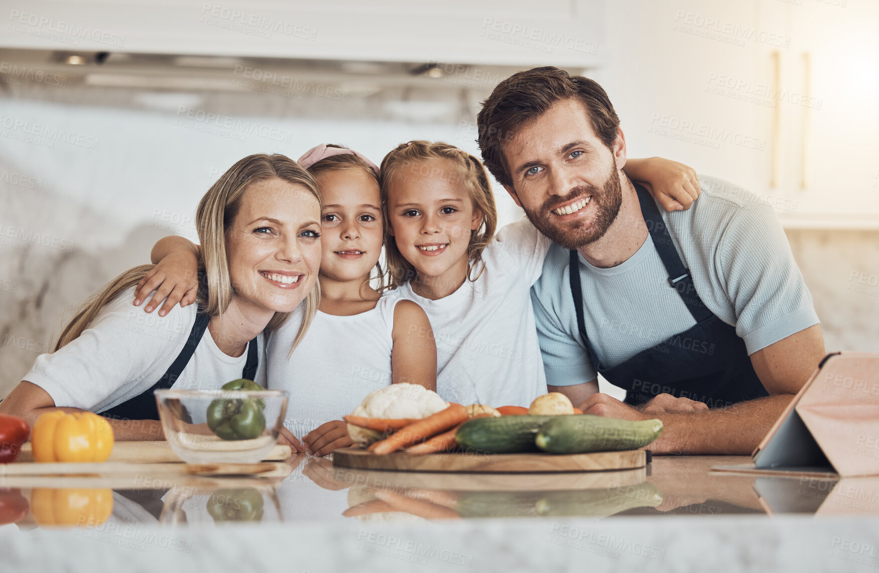 Buy stock photo Love, portrait and family cooking in kitchen together for bonding and preparing dinner, lunch or supper. Happy, smile and girl children and parents with vegetables or ingredients for meal at home.