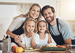 Family portrait, smile and cooking food in kitchen with vegetables for lunch, diet and nutrition. Happy parents and children, food and ingredients for meal prep, healthy and teaching the kids at home