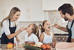 Kitchen, kids and parents with cooking, eating and ingredients with support, healthy eating and teaching. Family, children and mother with father, kids or home with bonding, recipe or smile with help