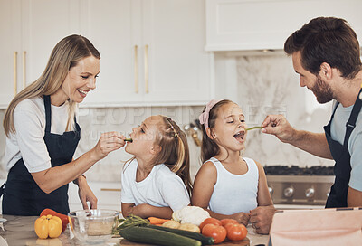 Buy stock photo Kitchen, kids and parents with cooking, eating and ingredients with support, healthy eating and teaching. Family, children and mother with father, kids or home with bonding, recipe or smile with help