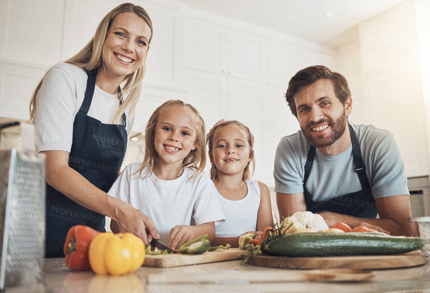 Buy stock photo Family portrait, smile and cooking in kitchen with vegetables for lunch, diet and nutrition. Happy parents and children, food and ingredients for meal prep, healthy and teaching the kids at home