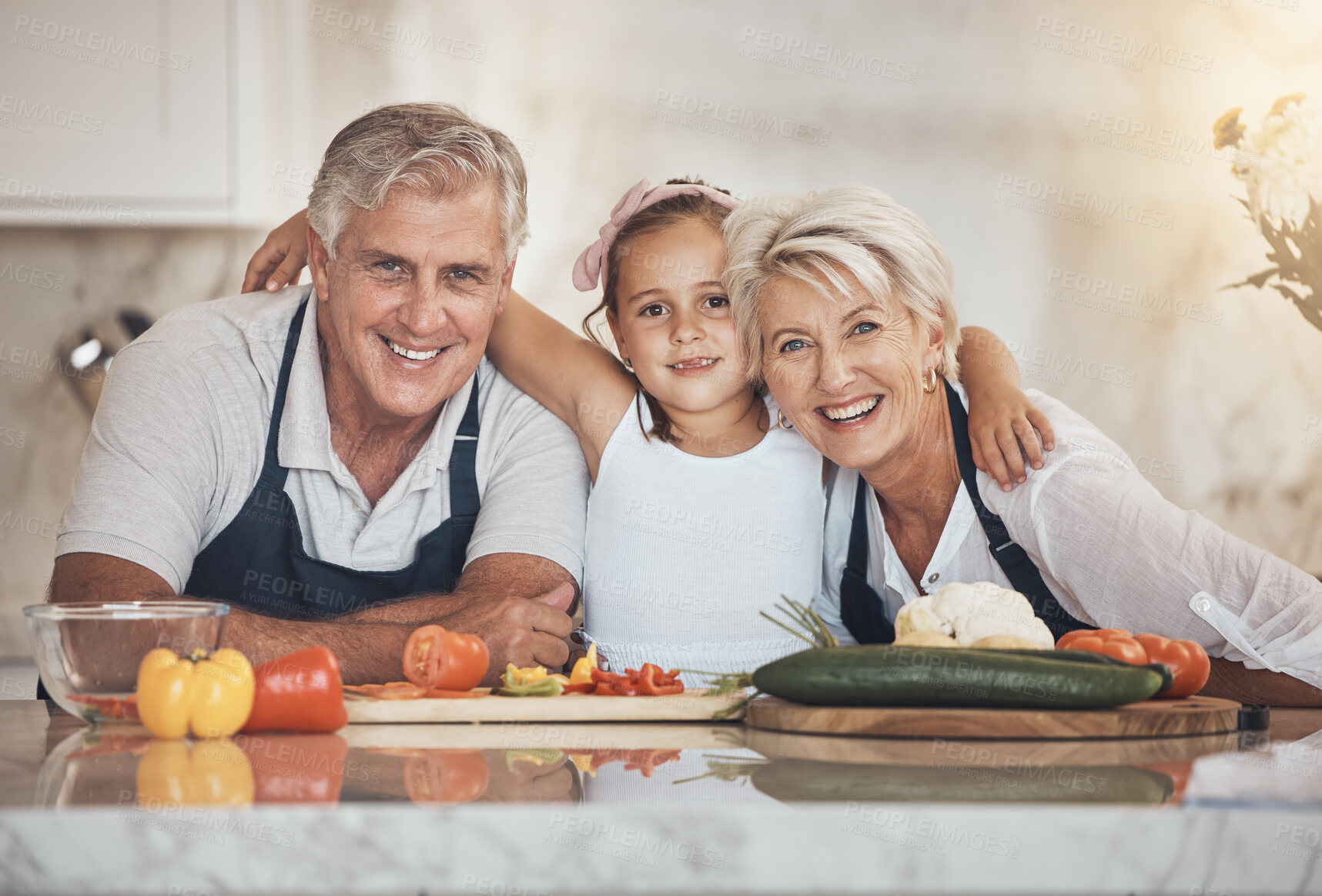 Buy stock photo Family portrait, cooking and girl child hug grandparents in kitchen bonding with vegetables. Food, love and face of old people enjoy retirement with kid, learning or teaching healthy meal preparation