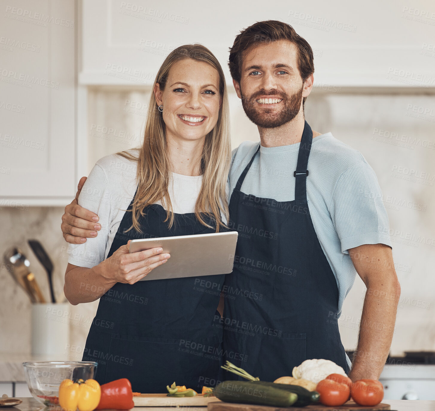 Buy stock photo Cooking, portrait or happy couple with tablet or food for a healthy vegan diet together at home. Smile, vegetables or woman bonding in kitchen with love or man learning a dinner recipe on online blog