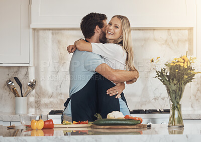 Buy stock photo Cooking, hug and happy couple in a kitchen with vegetables for organic brunch in their home together. Food, love and people embrace in a house while preparing a healthy, vegan or fresh, salad or meal