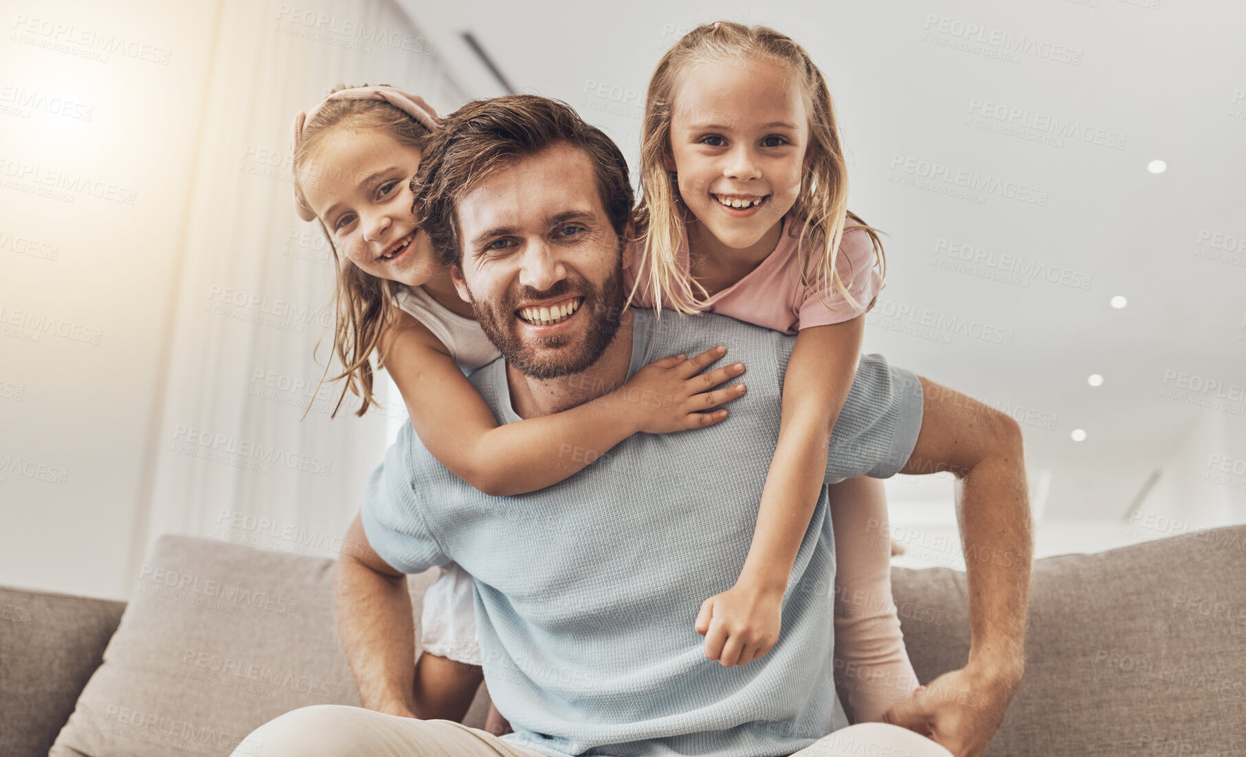 Buy stock photo Portrait, piggyback and girl kids with father on a sofa smile, bond and playing in their home together. Love, happy family and excited children hug parent in a living room with care, support and fun