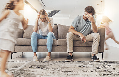 Buy stock photo Frustrated parents, sofa and headache with children running in living room chaos, ADHD or crazy home. Mother and father in stress, burnout or fatigue with busy or hyper active kids in lounge at house