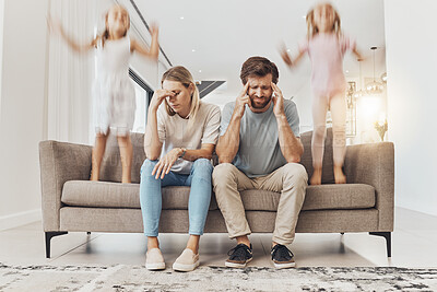 Buy stock photo Frustrated parents, sofa and headache with children jumping in living room chaos, ADHD or crazy home. Mother and father in stress, burnout or fatigue with busy or hyper active kids in lounge at house