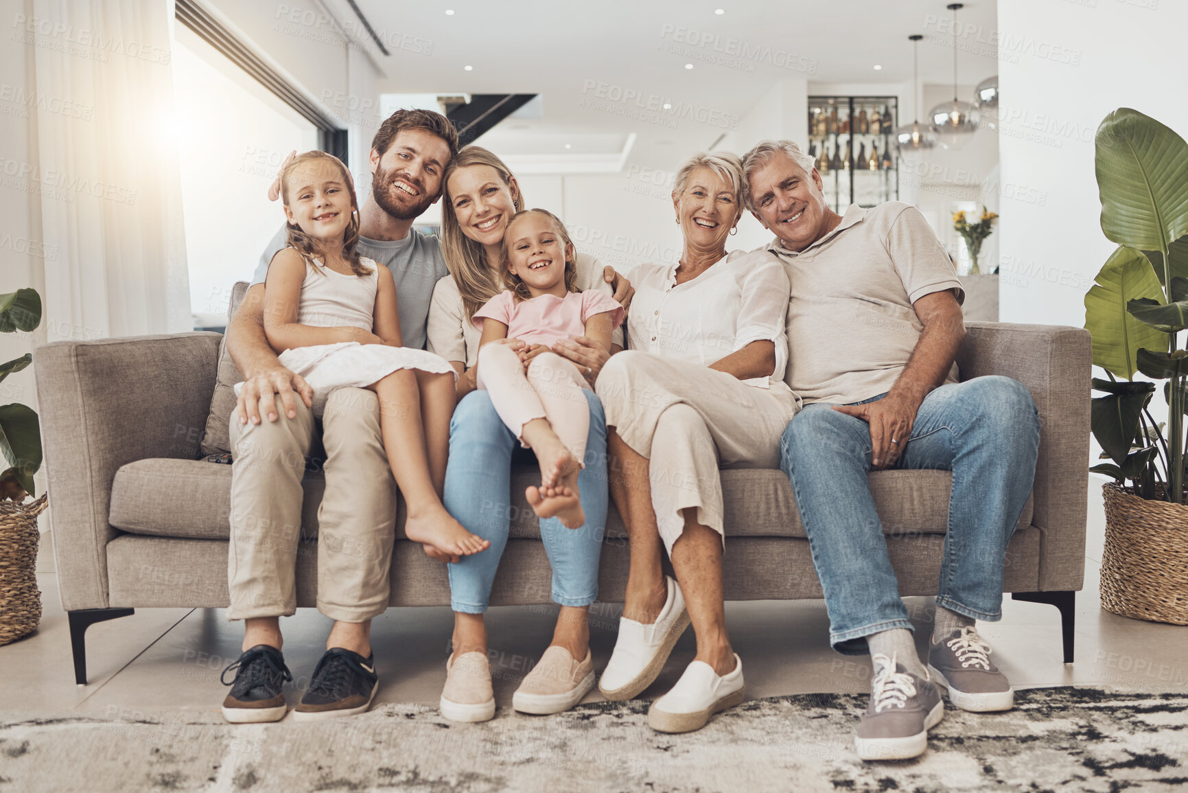 Buy stock photo Big family, smile and portrait in home living room, support and bonding together. Happy parents, grandparents and kids on sofa for connection, love children and care in healthy relationship in house