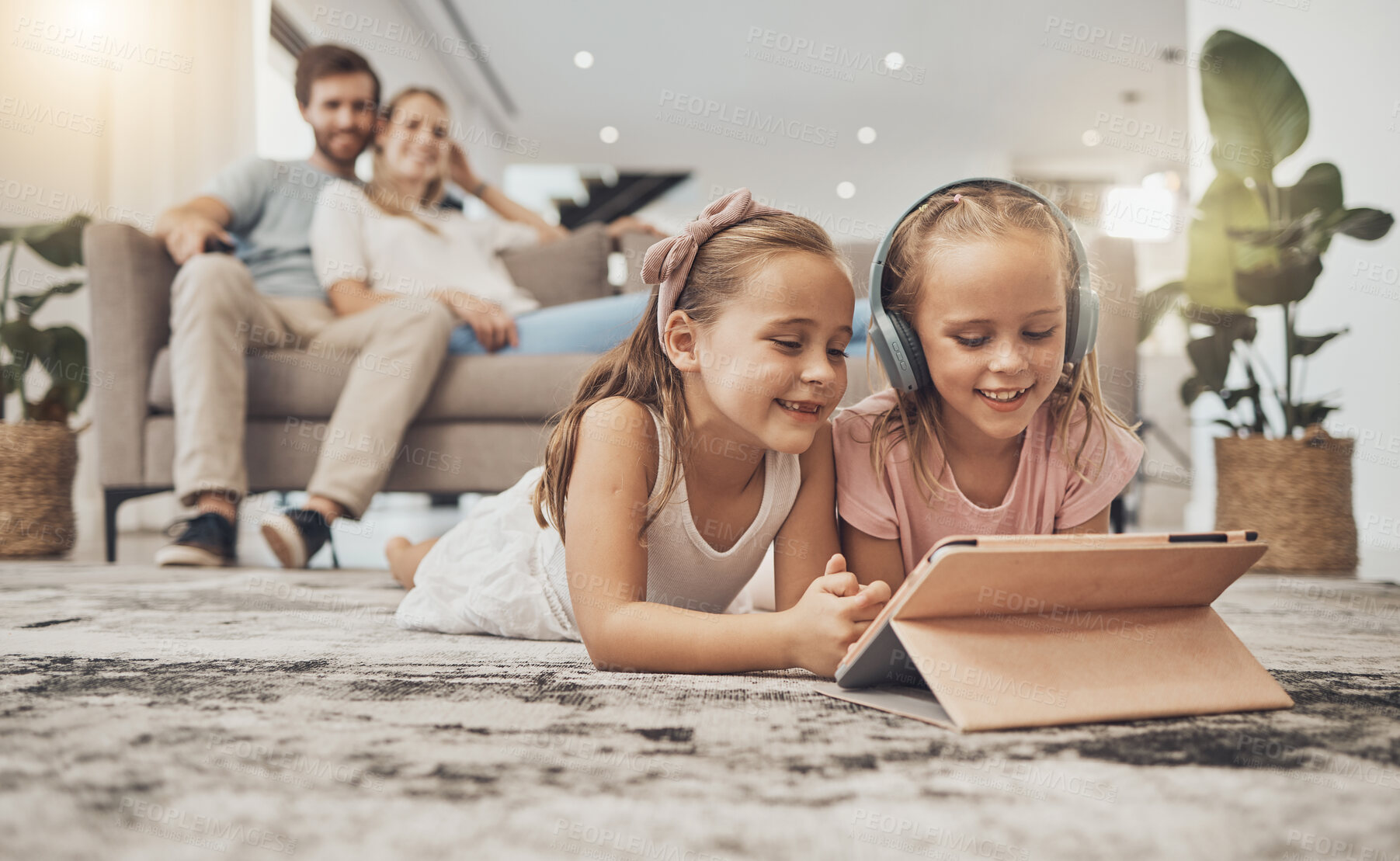 Buy stock photo Happy parents, siblings and children with tablet on floor in living room for entertainment together at home. Mom, dad and kids in lounge with technology for relax, enjoying or streaming at house