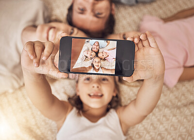 Buy stock photo Phone, selfie and top view of family on a floor with love, fun and smile for social media post at home. Smartphone, profile picture and girl children with parents in a living room for weekend memory