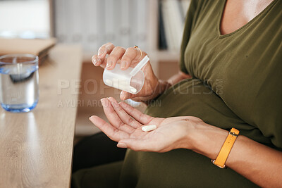 Buy stock photo Drugs in hand, pregnant woman with health and supplement for baby, prescription and prenatal vitamins at desk. Medicine at work, healthcare and pharmaceutical pills for healthy pregnancy and iron