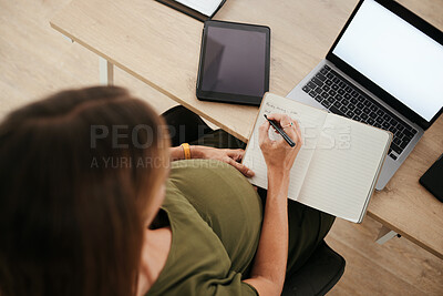 Buy stock photo Pregnancy, business woman writing schedule in book or planning in office top view on laptop mockup. Pregnant secretary at desk working on notes for timetable, agenda reminder or list of receptionist