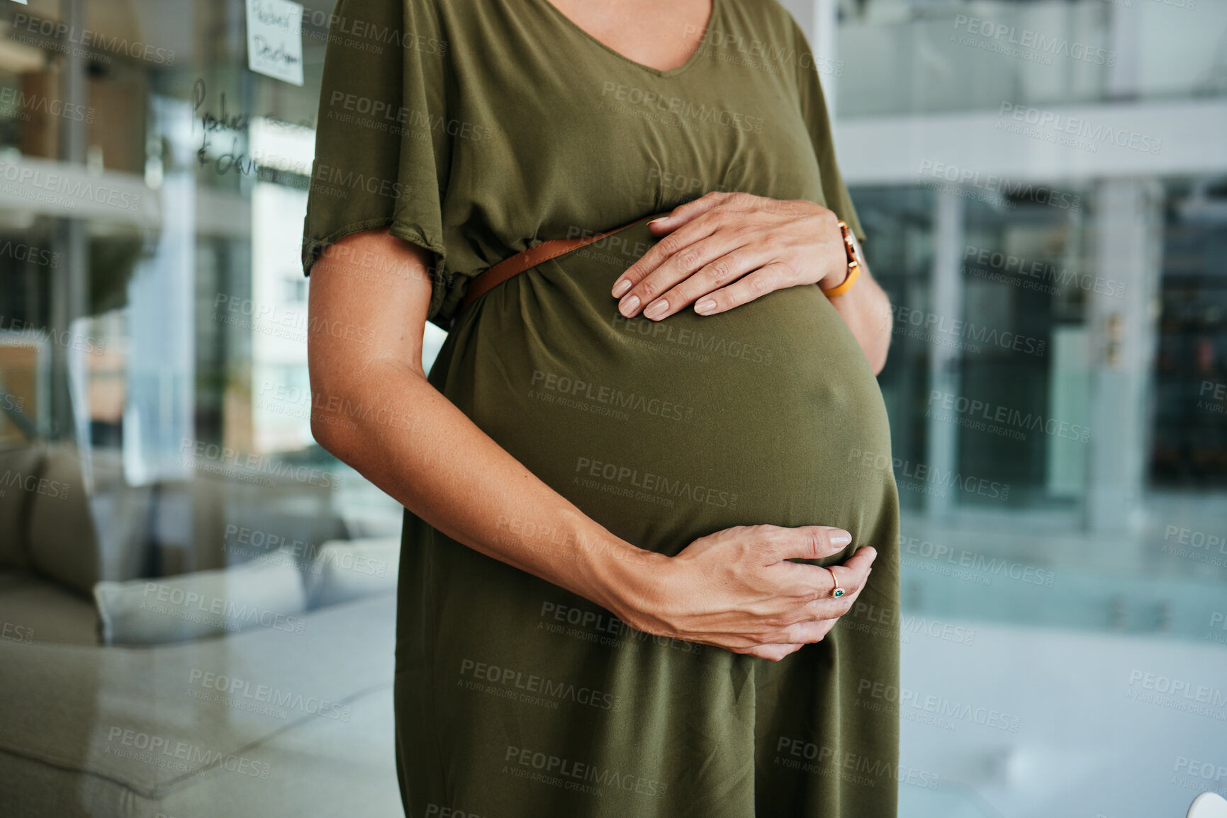 Buy stock photo Pregnancy care, stomach and hands of woman feeling, massage and touch baby development, body or belly. Maternity, office closeup and pregnant person love, support and hope for future motherhood