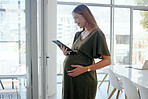 Tablet, office and pregnant business woman doing research and reading information on internet. Maternity, career and female designer from Canada with pregnancy work on digital technology in workplace