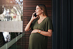 Pregnant, woman and phone call in office planning a schedule, appointment or communication. Cellphone, conversation and talking of pregnancy, maternity or contact with human resources in workplace