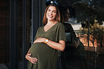 Portrait, smile and a business pregnant woman on the balcony at her office, excited about maternity leave from work. Company, stomach and pregnancy with a happy young employee at the workplace