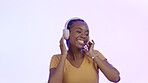 Smile, headphones and black woman with a cellphone, streaming music and internet on a pink studio background. African person, model or girl with a headset, audio or smartphone with radio or listening