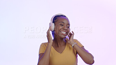 Buy stock photo Smile, headphones and black woman with a cellphone, streaming music and internet on a pink studio background. African person, model or girl with a headset, audio or smartphone with radio or listening